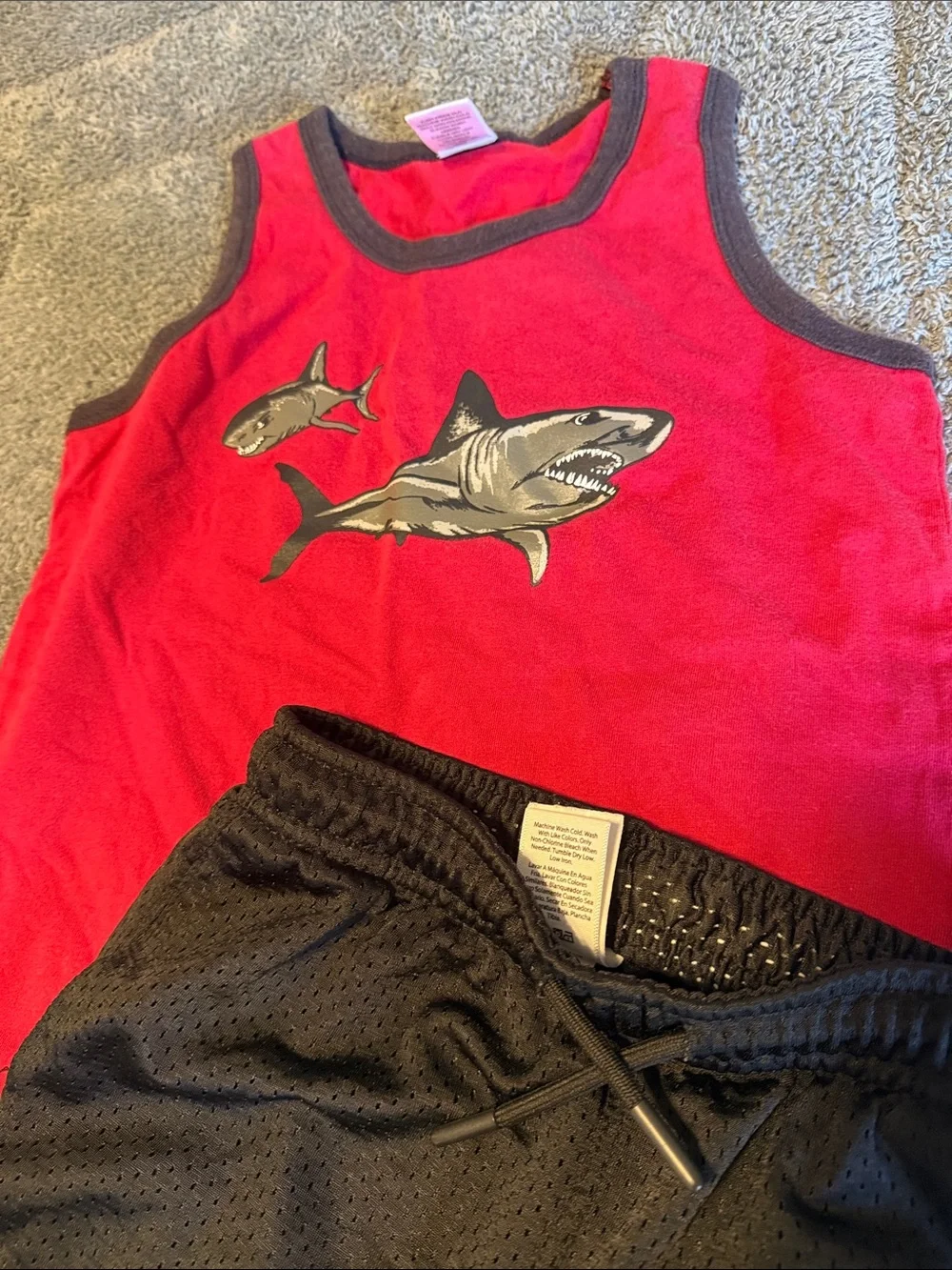 Red Shark Tank Top with Black Athletic Shorts